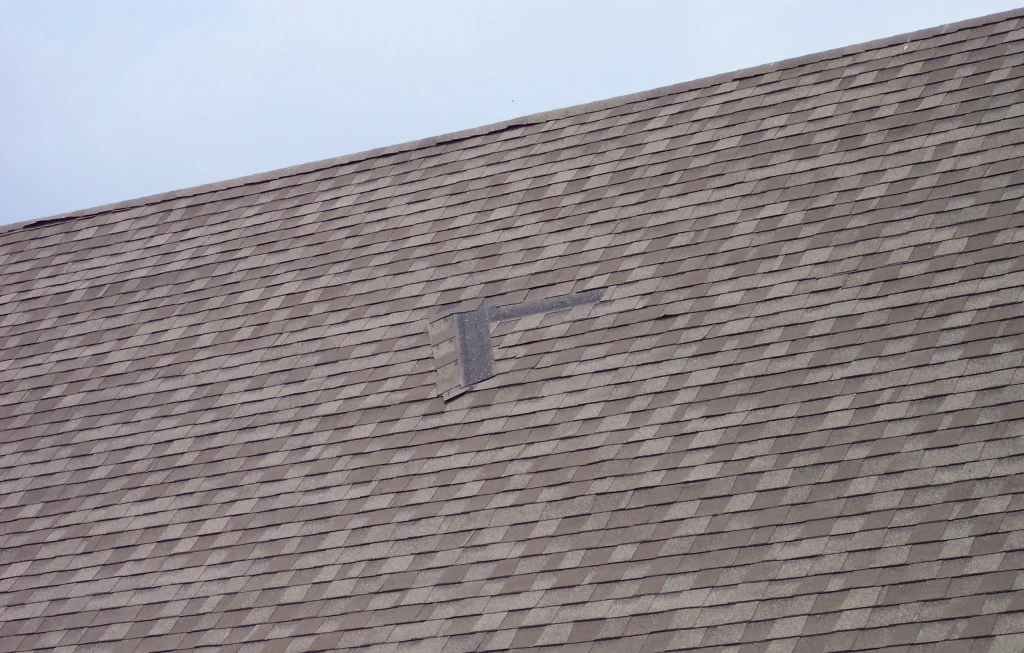 Air-gunned shingles falling out of roof