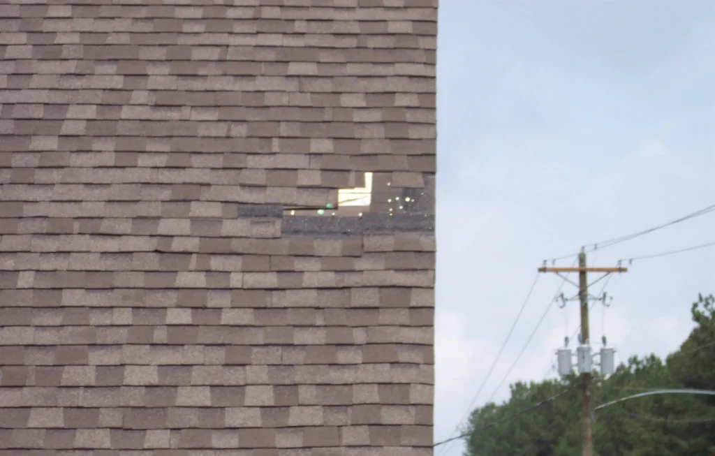 Loose, missing shingles because they were air-gunned